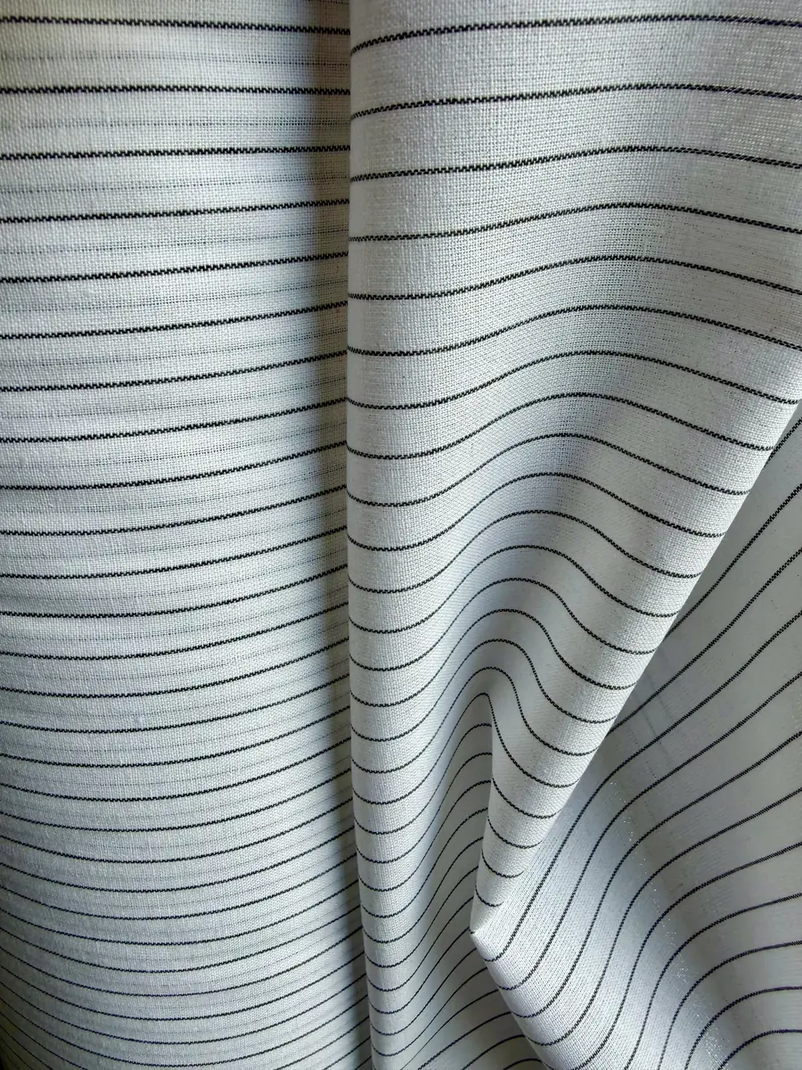 Fabric rolls in stillages — real stock warehouse, Textilagentur Leonardo Prato